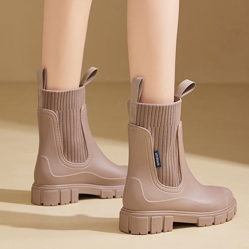 Waterproof, non-slip boots with a thick mid-calf sole